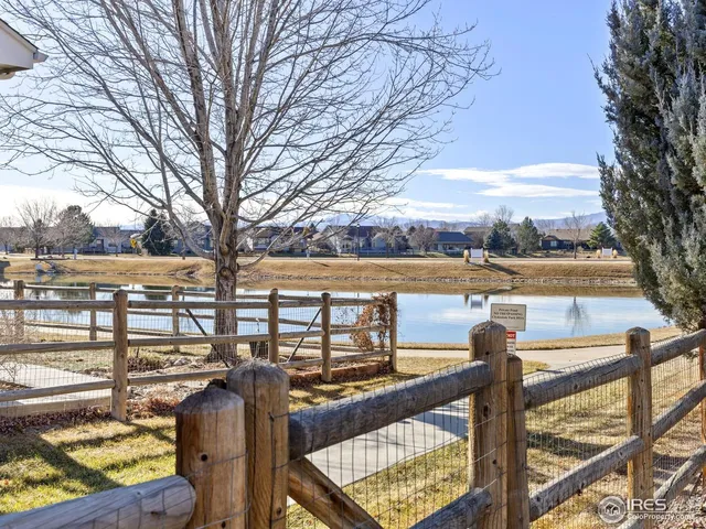a bathroom with a glass shower door and a mirror