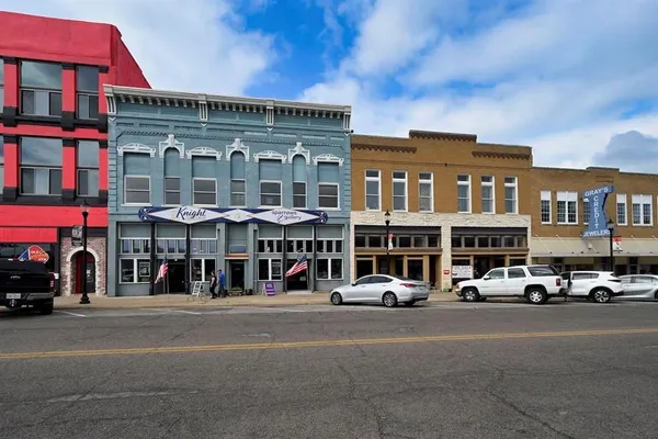 a front view of building with street