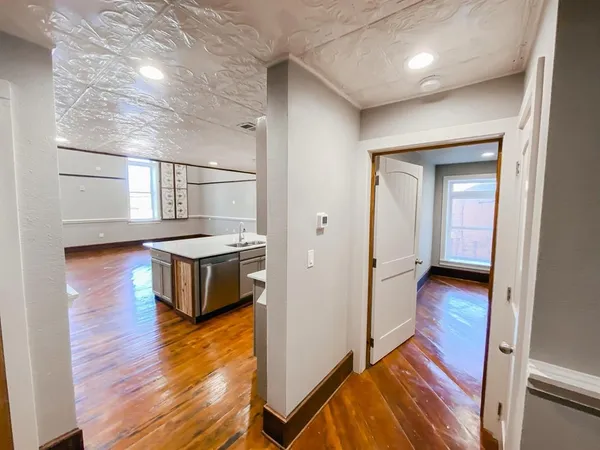 a view of a kitchen from the hallway