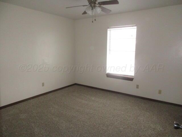 4904 South Georgia Street Amarillo, TX 79110 - Photo 3 of 12 an empty room with a window