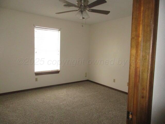 4904 South Georgia Street Amarillo, TX 79110 - Photo 8 of 12 an empty room with a window