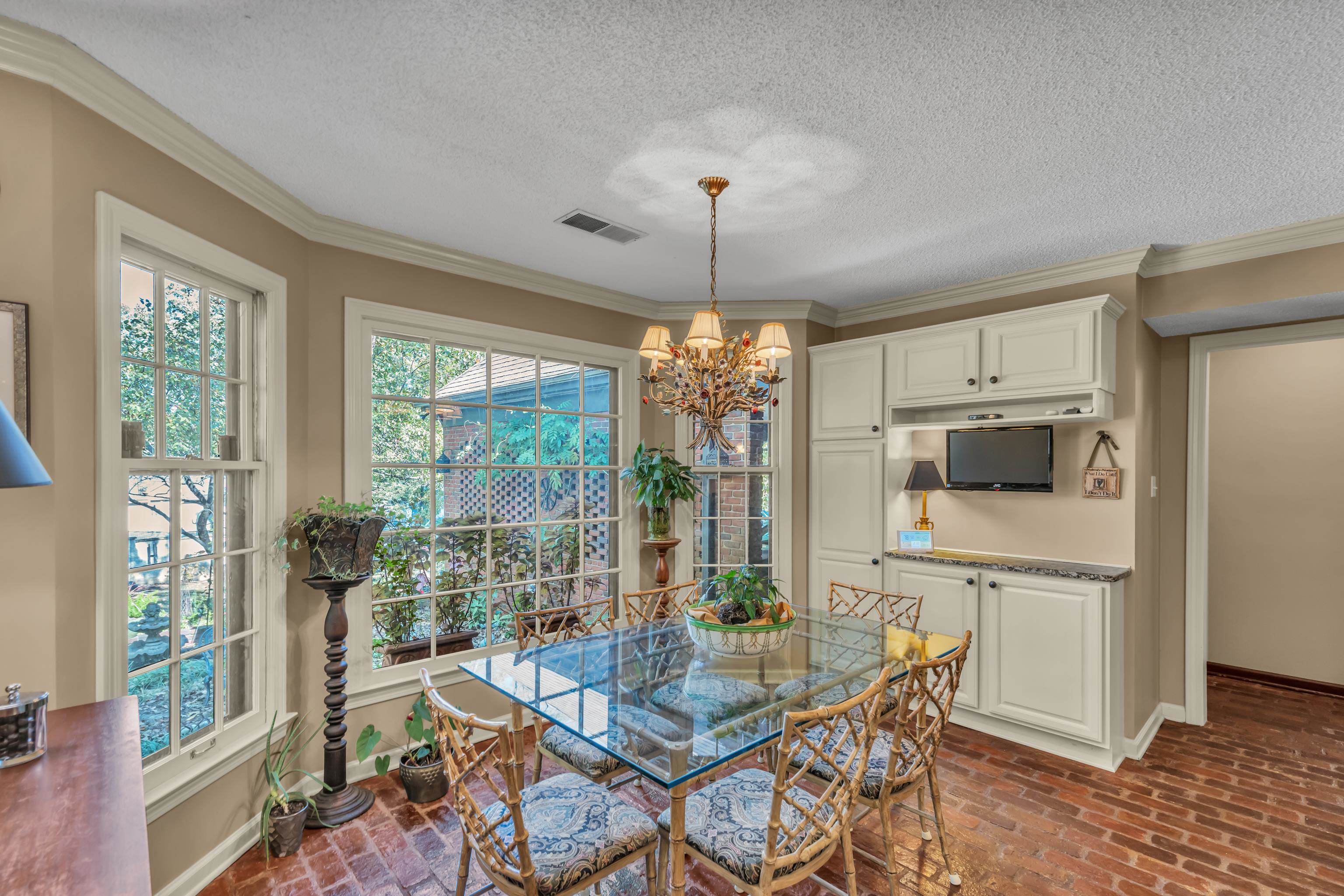 2002 Magnolia Ridge Cove Germantown, TN 38138 - Photo 15 of 40 Dining room featuring crown molding, a textured ceiling, and an inviting chandelier