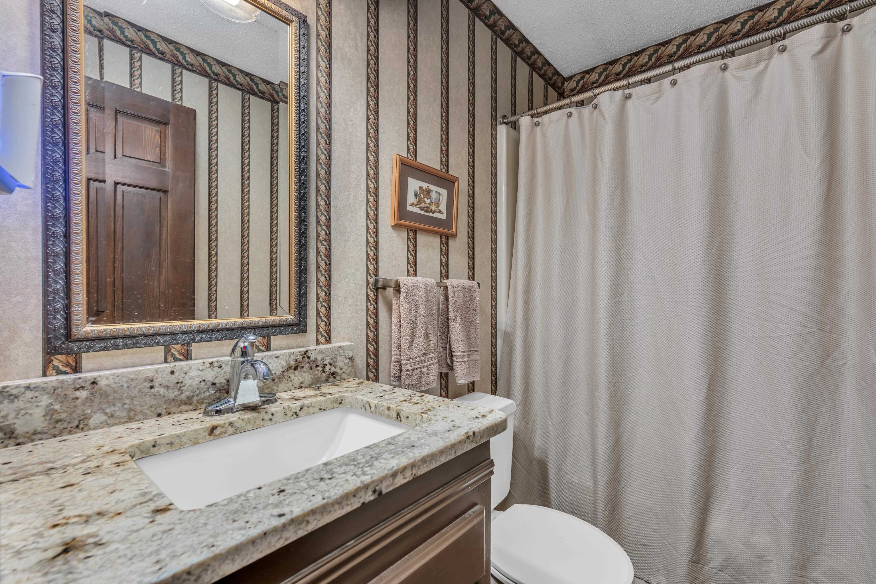 2002 Magnolia Ridge Cove Germantown, TN 38138 - Photo 25 of 40 Bathroom with toilet, a textured ceiling, a shower with curtain, and vanity