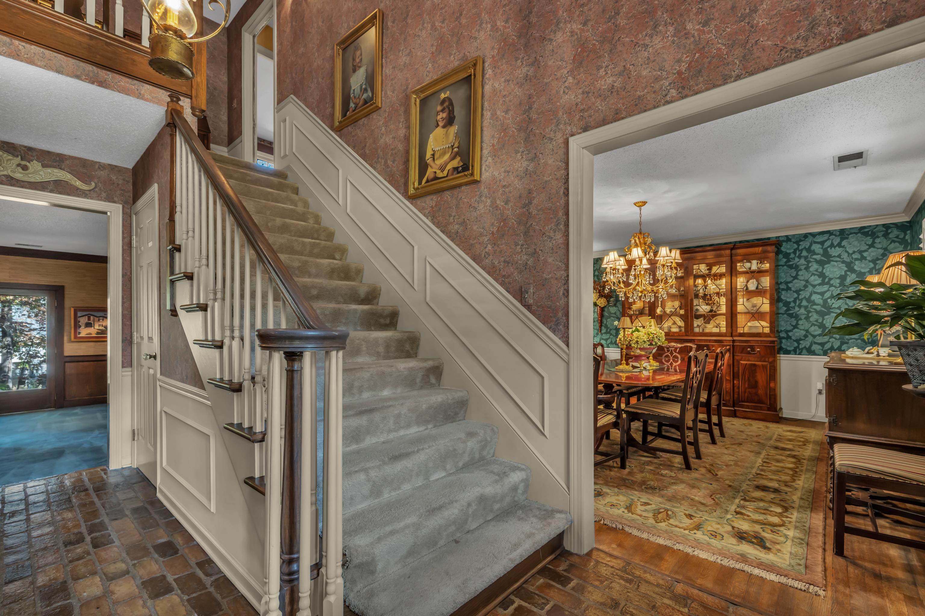 2002 Magnolia Ridge Cove Germantown, TN 38138 - Photo 5 of 40 Stairway featuring ornamental molding and a chandelier
