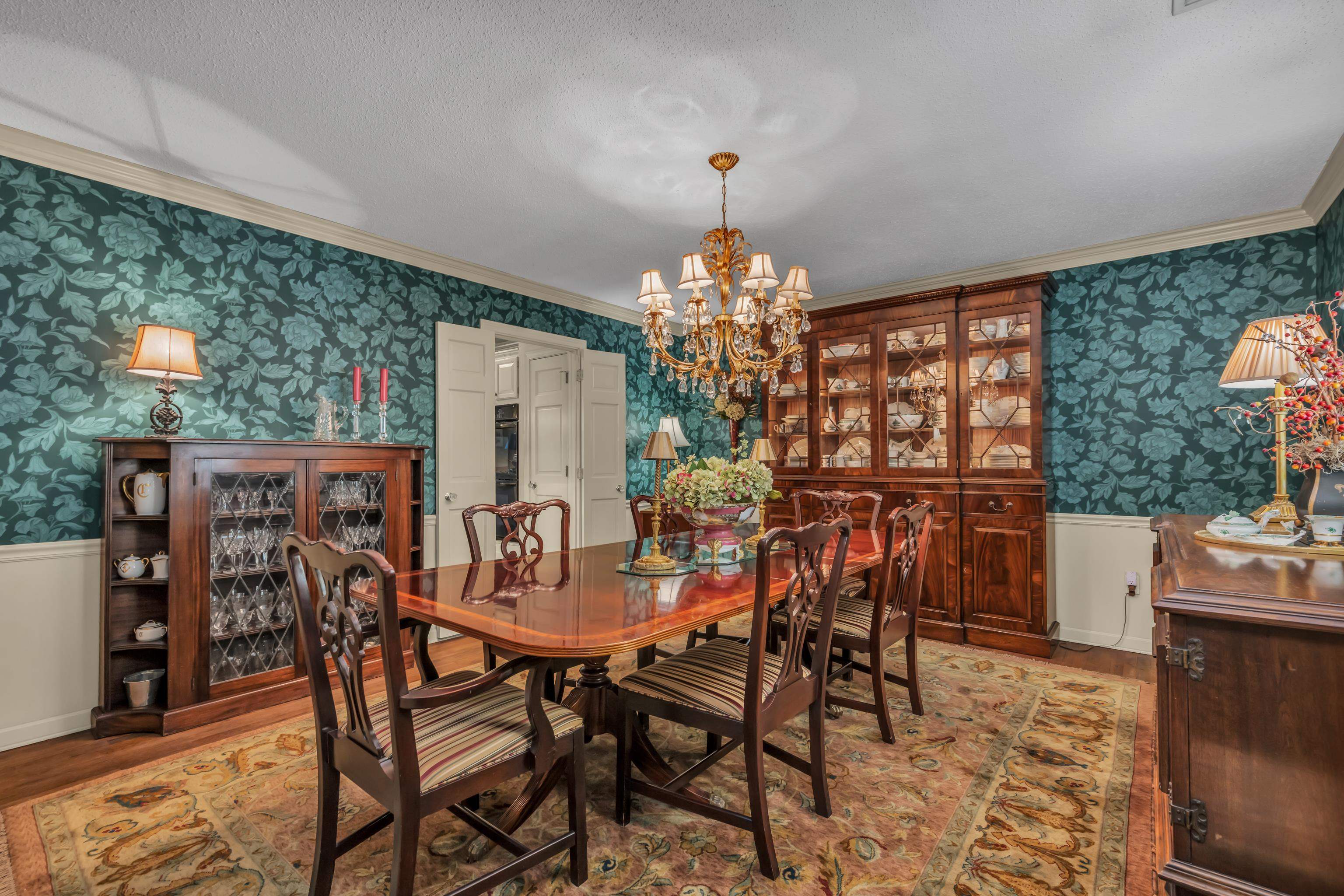 2002 Magnolia Ridge Cove Germantown, TN 38138 - Photo 6 of 40 Dining area with a textured ceiling, ornamental molding, light hardwood / wood-style flooring, and a chandelier