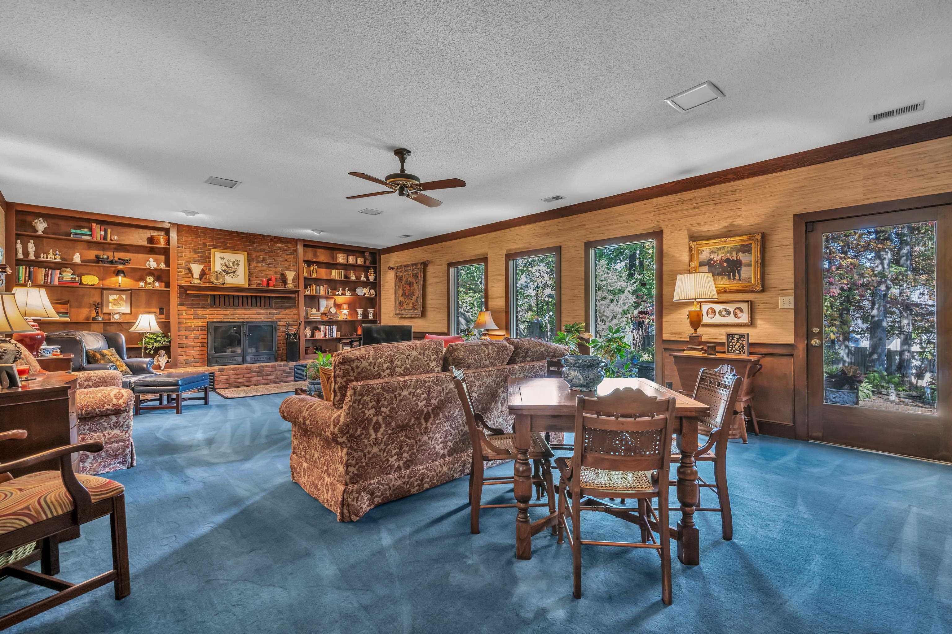 2002 Magnolia Ridge Cove Germantown, TN 38138 - Photo 8 of 40 Living room featuring dark colored carpet and a wealth of natural light