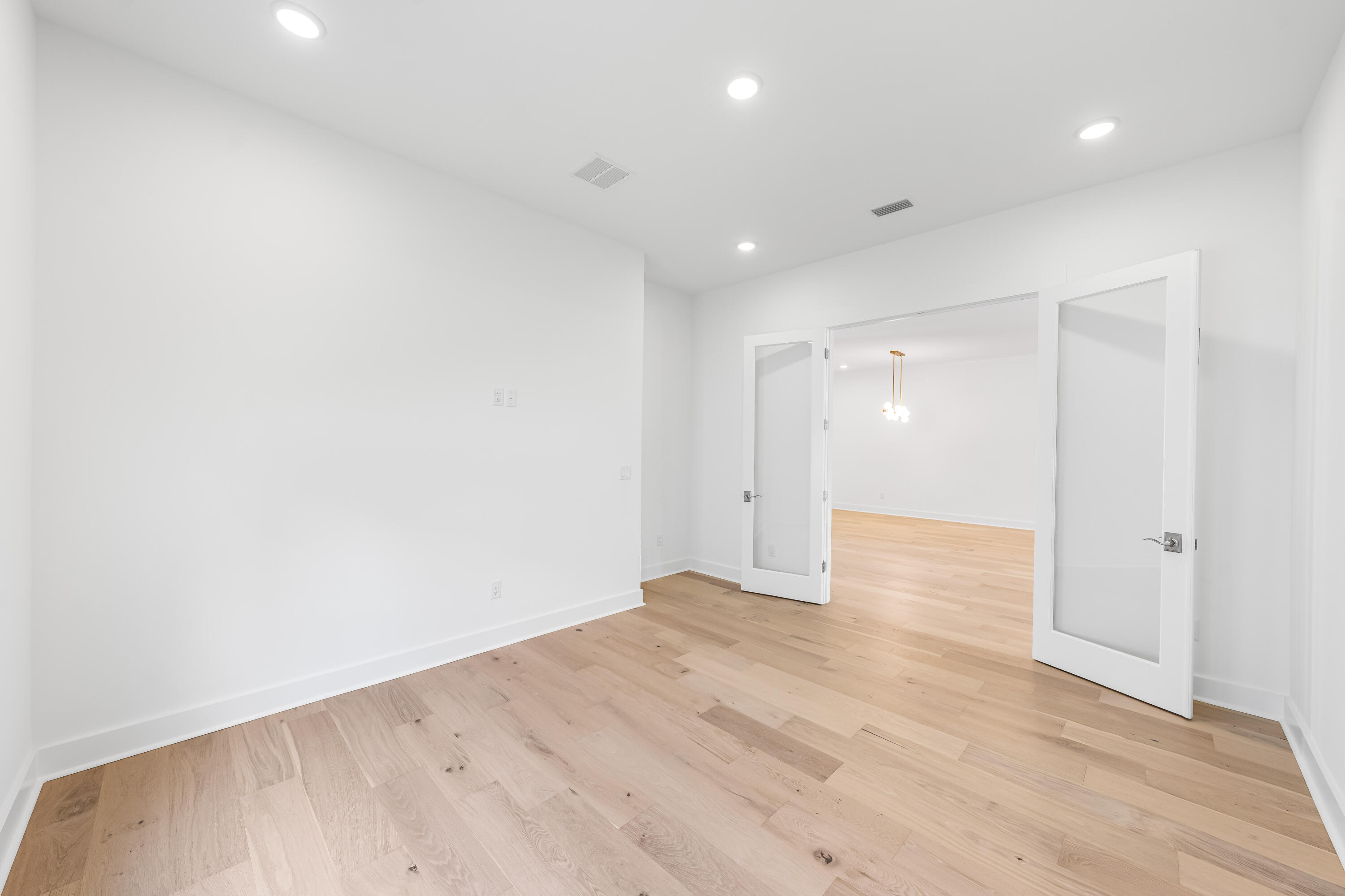 2351 Pathways Dr Inlet Beach Inlet Beach, FL 32461 - Photo 4 of 29 an empty room with wooden floor and windows