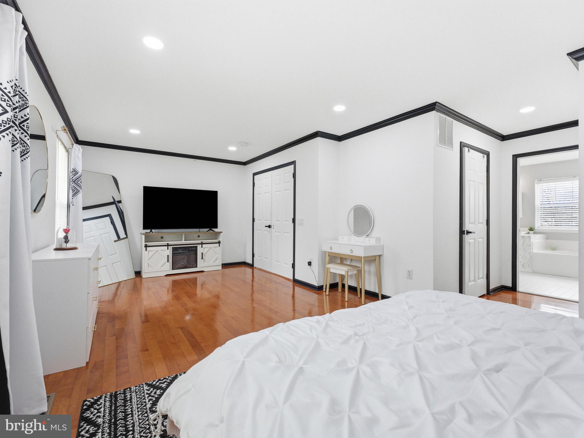 101 Weatherhill Court Hainesport, NJ 08036 - Photo 19 of 41 a bedroom with a bed and a flat screen tv