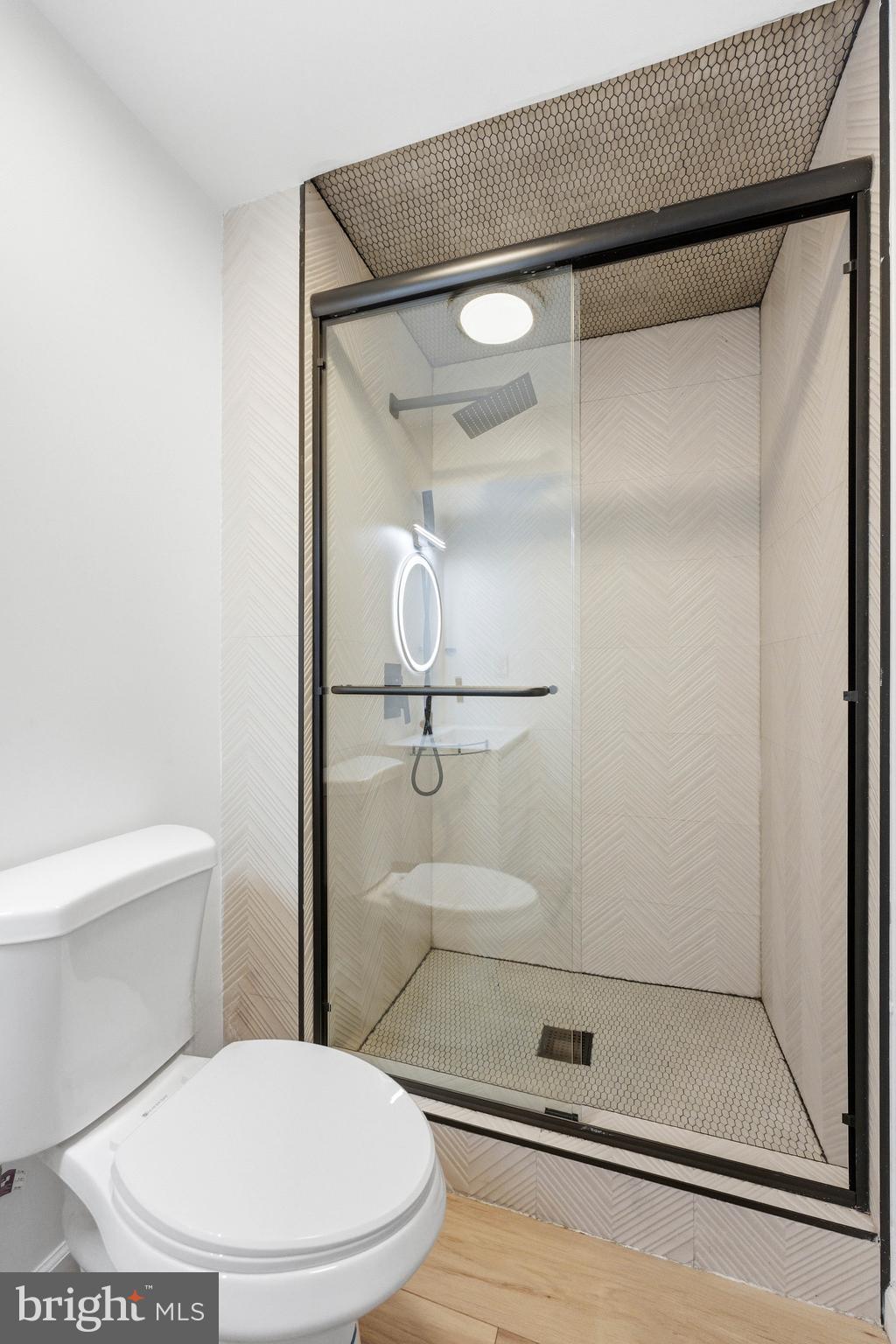 101 Weatherhill Court Hainesport, NJ 08036 - Photo 32 of 41 a bathroom with a toilet and a glass shower door
