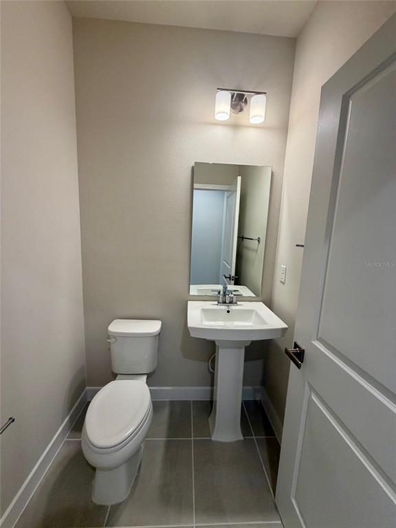 602 Highfalls Avenue DeBary, FL 32713 - Photo 11 of 29 a bathroom with a sink toilet and mirror