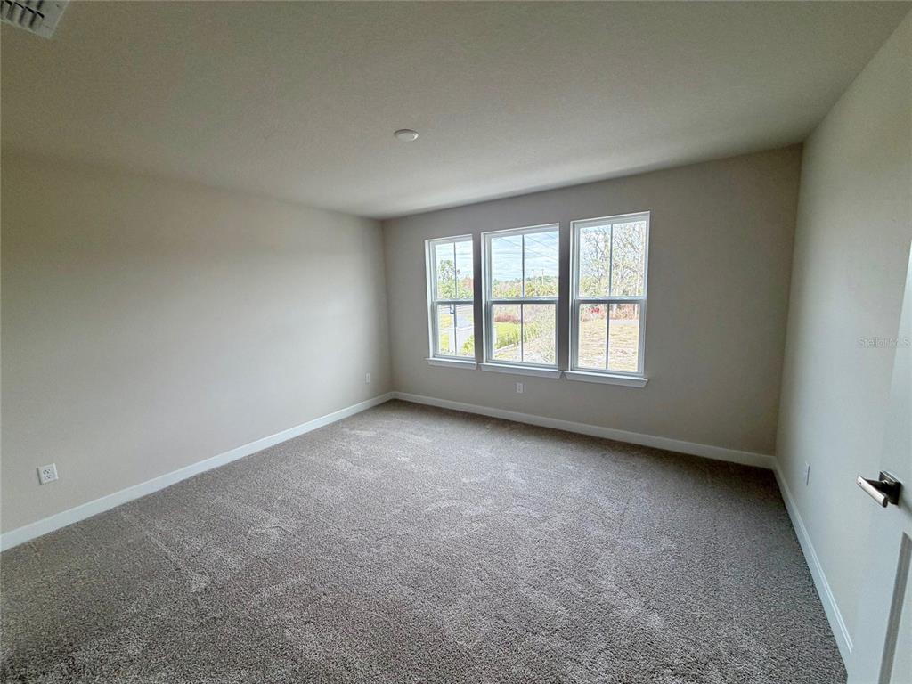 602 Highfalls Avenue DeBary, FL 32713 - Photo 16 of 29 an empty room with a window