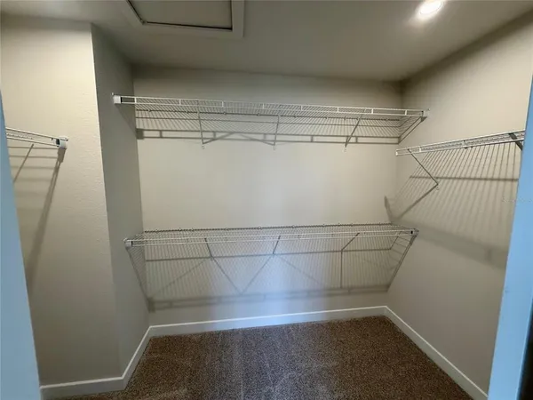 a view of a room with racks on the wall
