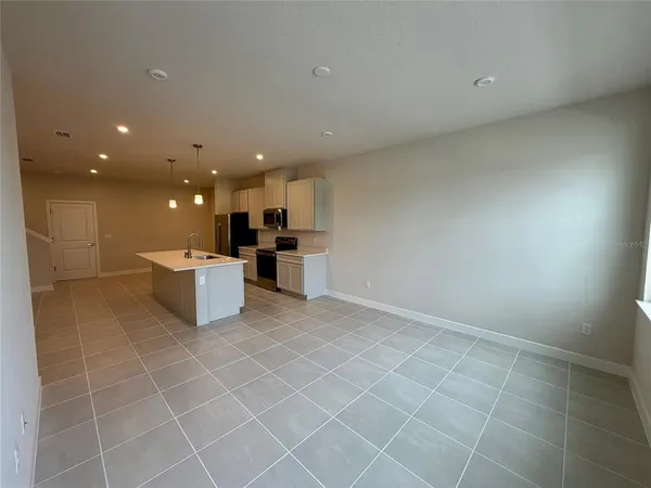 a view of a kitchen with furniture and window