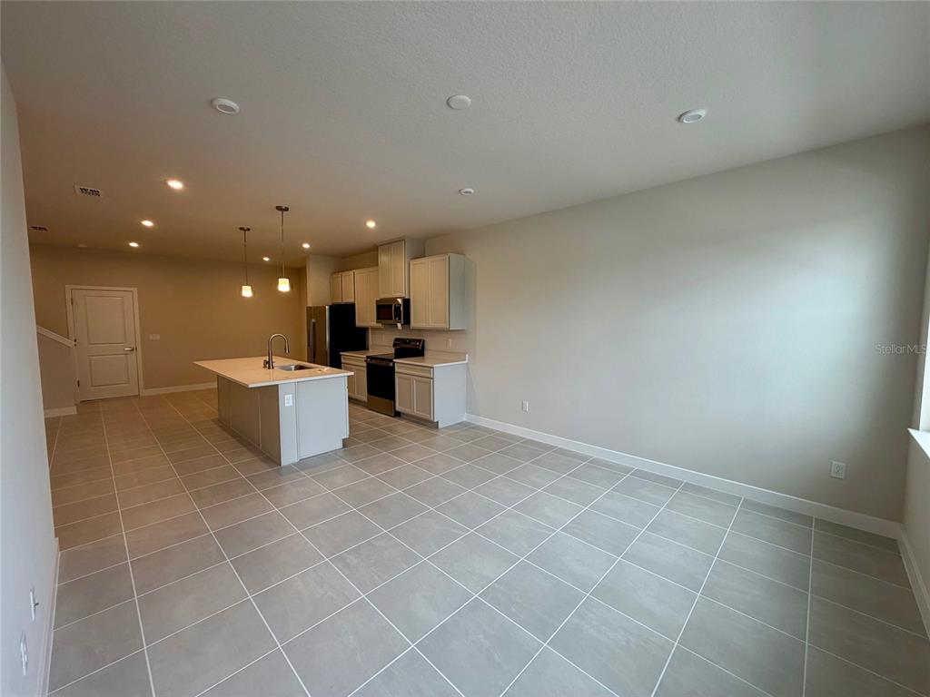 602 Highfalls Avenue DeBary, FL 32713 - Photo 2 of 29 a view of a kitchen with furniture and window