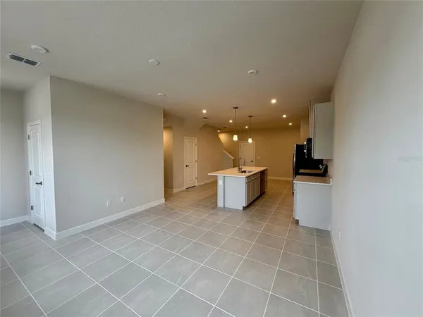 a view of a storage & utility room with a sink