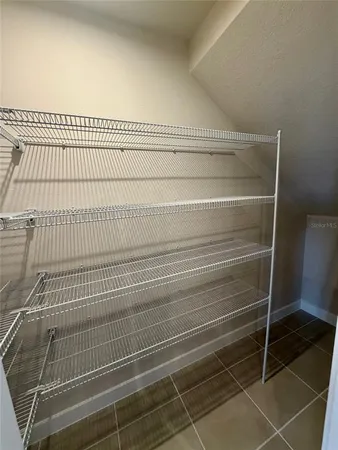 a view of a air conditioner and wooden floor