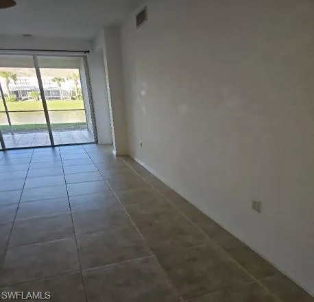a view of an empty room and window