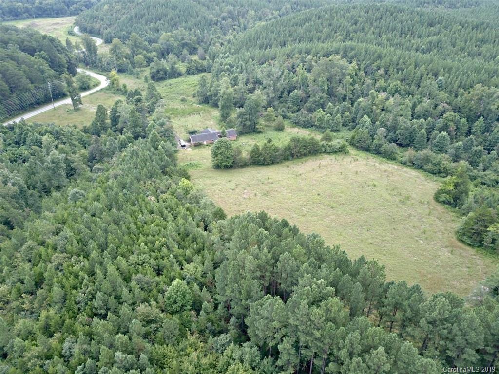 999 Holbert Cove Road Saluda, NC 28773 - Photo 2 of 14 an aerial view of residential houses with outdoor space and trees