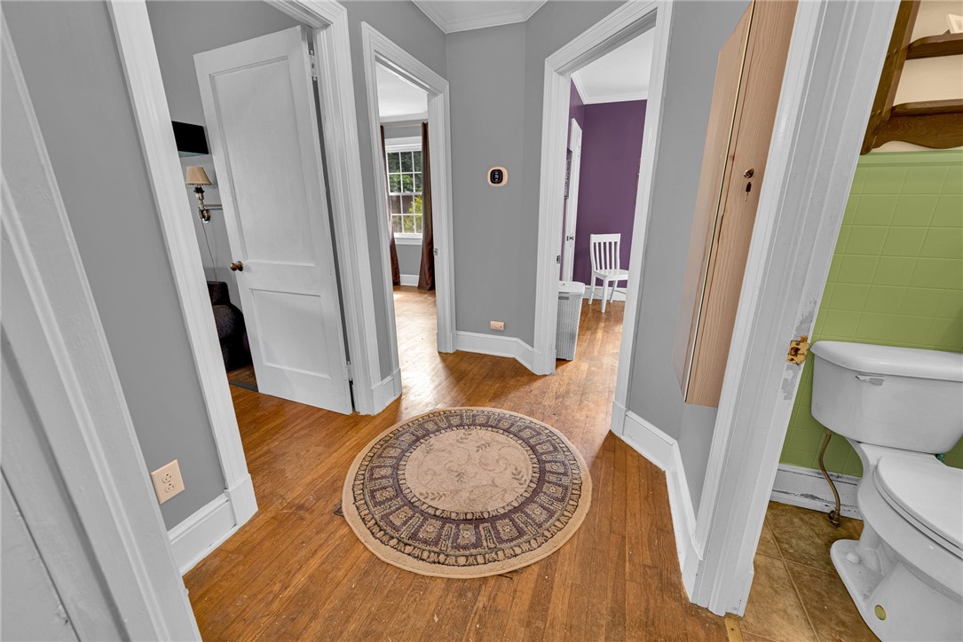 102 Graham Honea Path, SC 29654 - Photo 19 of 29 Rich hardwood flooring guides the way through a thoughtfully arranged interior with multiple open doorways.