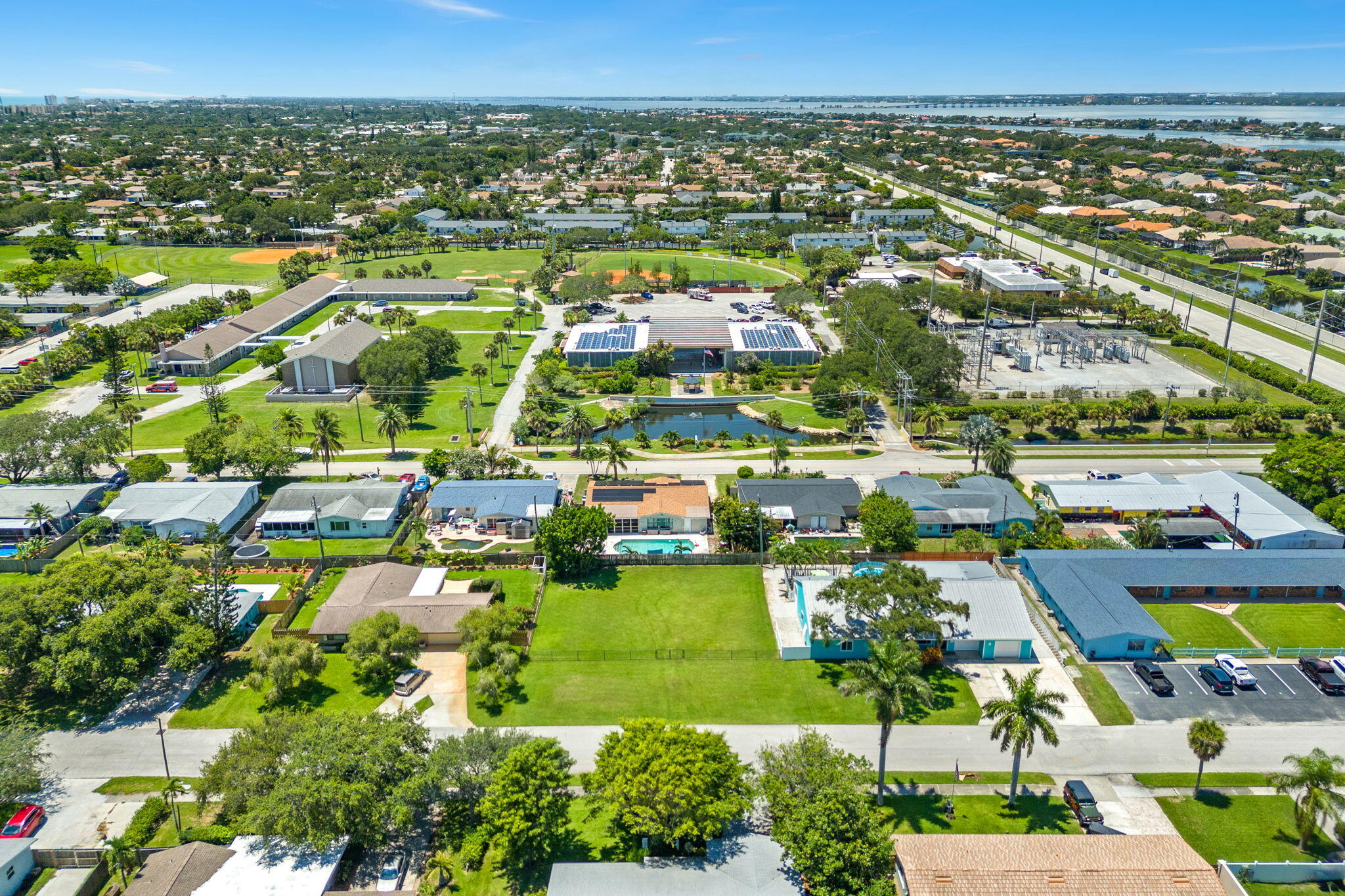 575 Cinnamon Drive Satellite Beach, FL 32937 - Photo 13 of 16 an aerial view of residential houses with outdoor space