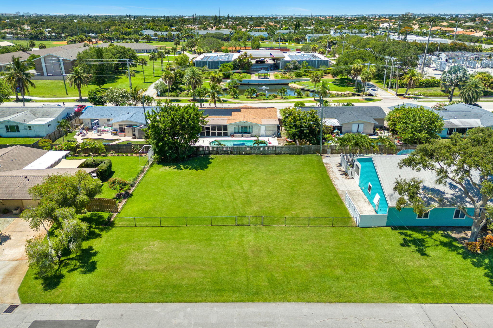 575 Cinnamon Drive Satellite Beach, FL 32937 - Photo 3 of 16 an aerial view of residential houses with outdoor space and swimming pool