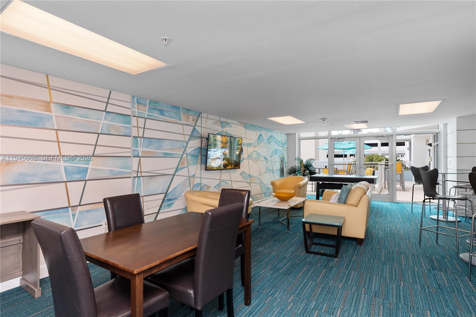 1723 Southwest 2nd Avenue, Unit 1104 Miami, FL 33129 - Photo 13 of 15 a view of a dining room with furniture and wooden floor