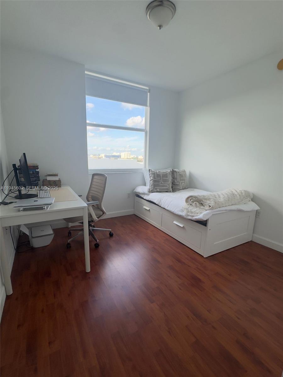 1723 Southwest 2nd Avenue, Unit 1104 Miami, FL 33129 - Photo 8 of 15 a living room with furniture and a table