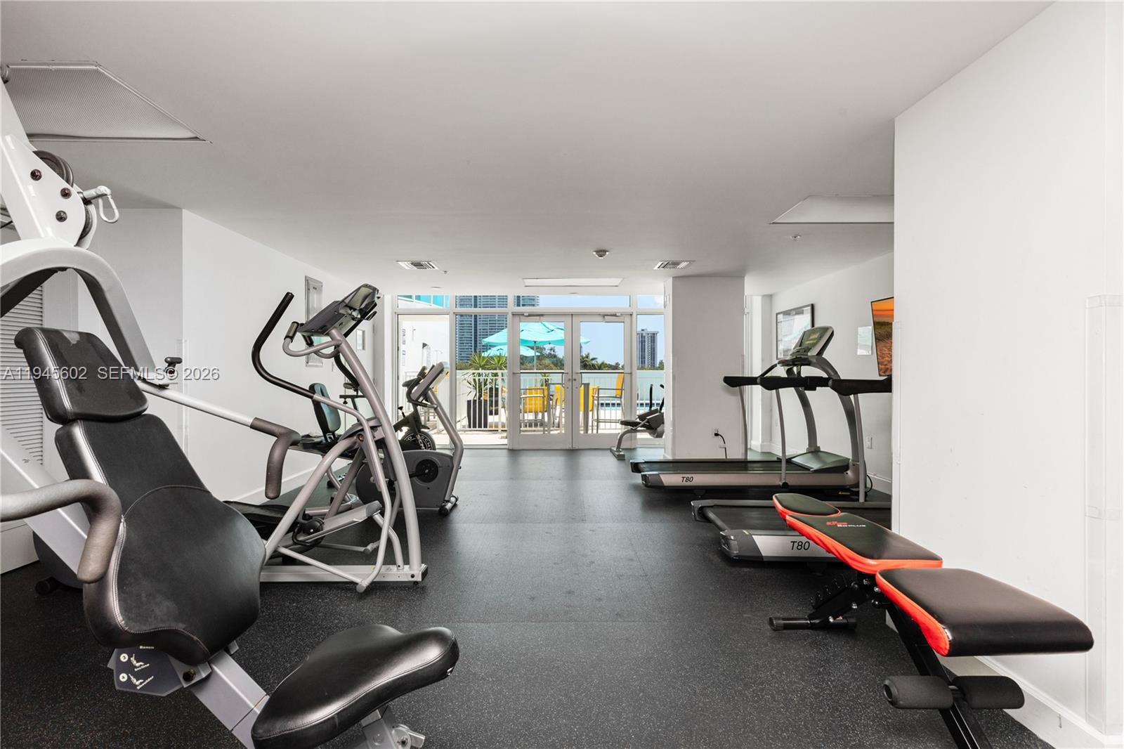 1723 Southwest 2nd Avenue, Unit 1104 Miami, FL 33129 - Photo 10 of 15 a view of a room with gym equipment