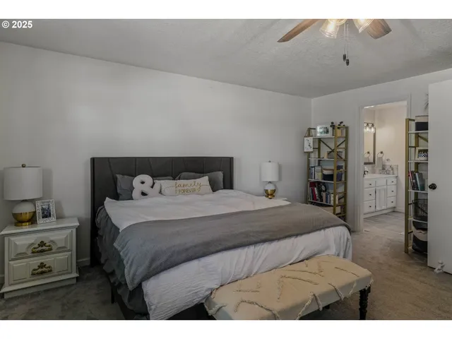 a bathroom with a sink a mirror a vanity and a shower