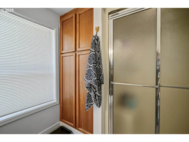 a bedroom with a bed and a chair