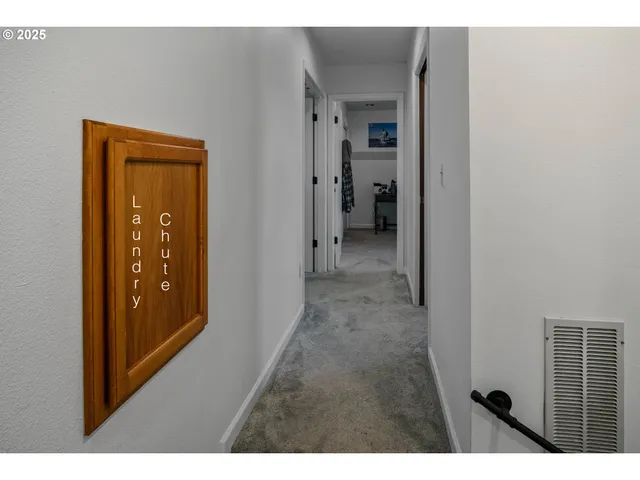 a view of a bathroom from a hallway