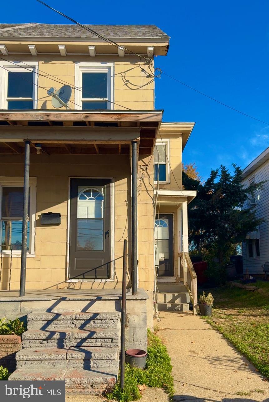 137 Penn Street Bridgeton, NJ 08302 - Photo 1 of 2 a front view of a house with a yard