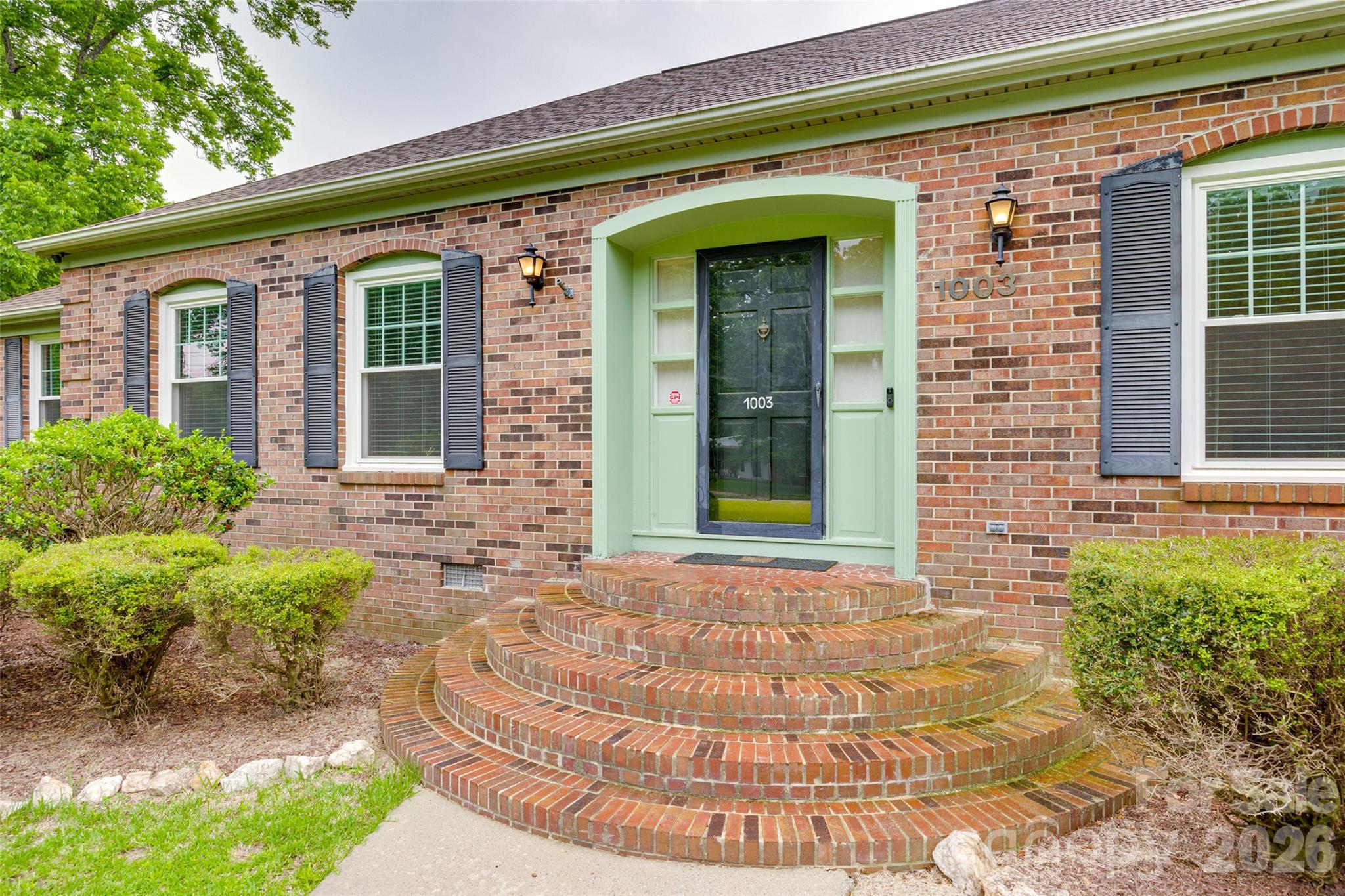 1003 Chesterfield Avenue Lancaster, SC 29720 - Photo 13 of 31 a front view of a house with garden