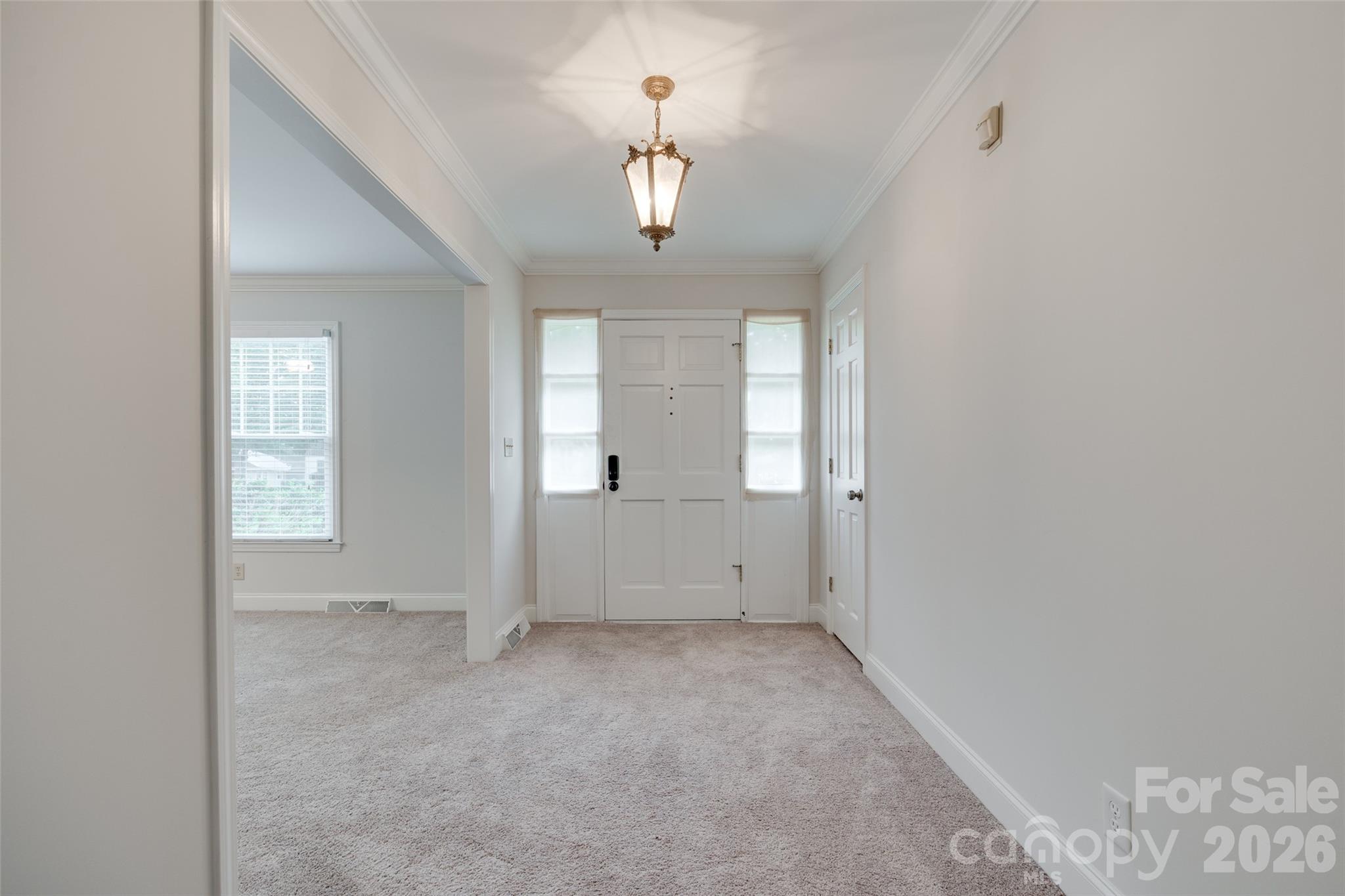 1003 Chesterfield Avenue Lancaster, SC 29720 - Photo 14 of 31 wooden floor in an empty room with a window