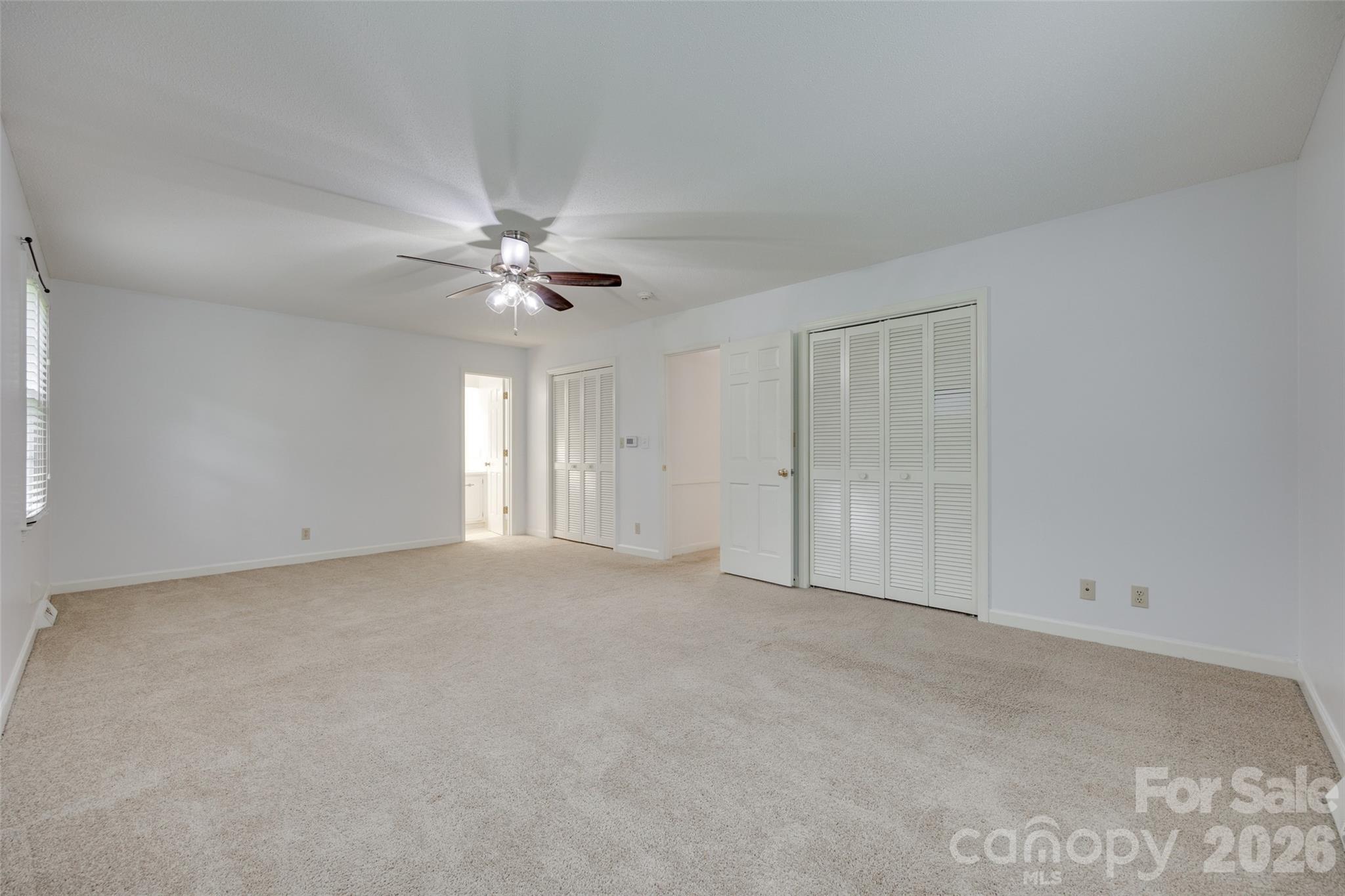 1003 Chesterfield Avenue Lancaster, SC 29720 - Photo 19 of 31 a view of an empty room with a ceiling fan