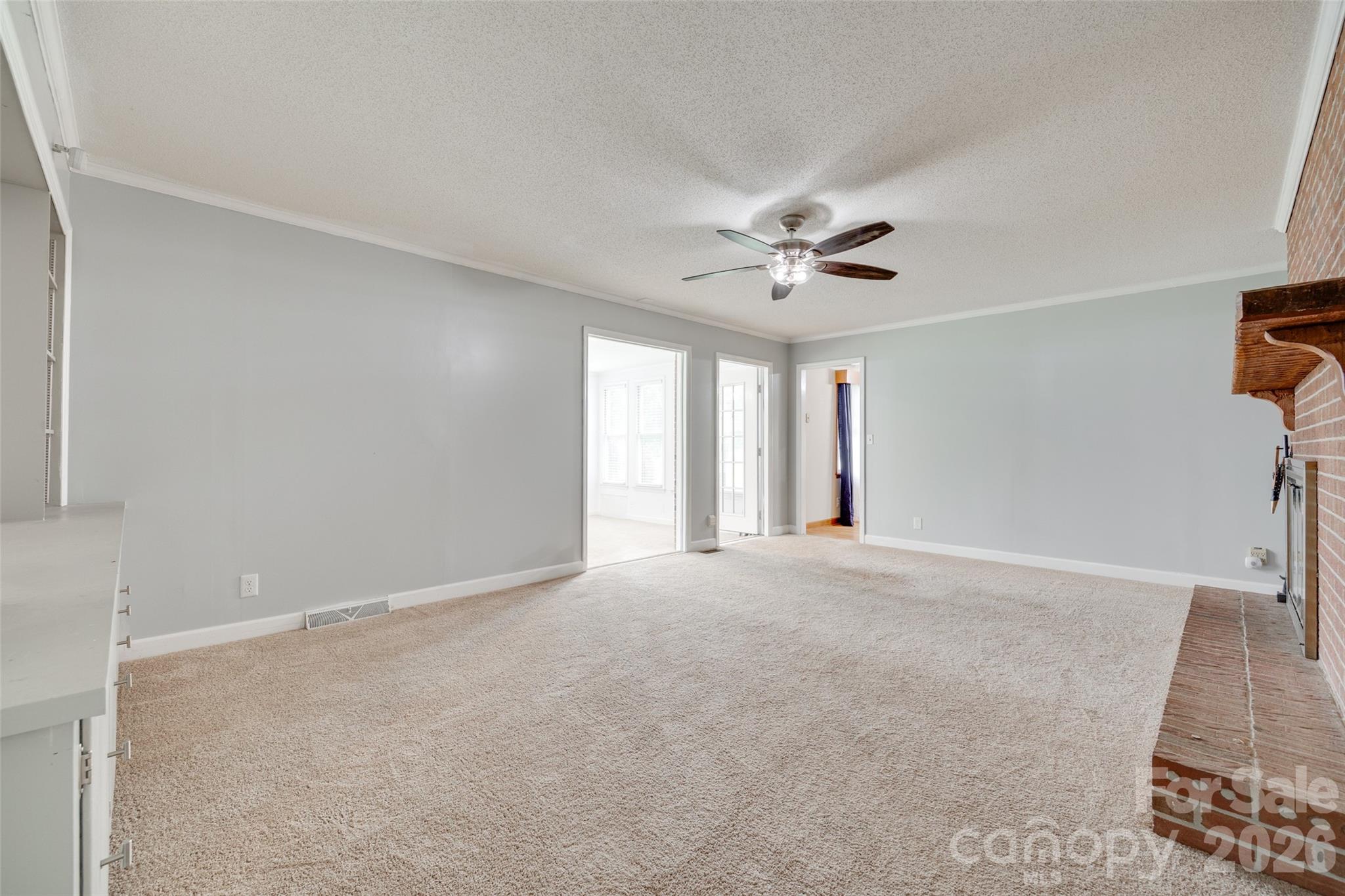 1003 Chesterfield Avenue Lancaster, SC 29720 - Photo 22 of 31 a view of an empty room with chandelier fan and window