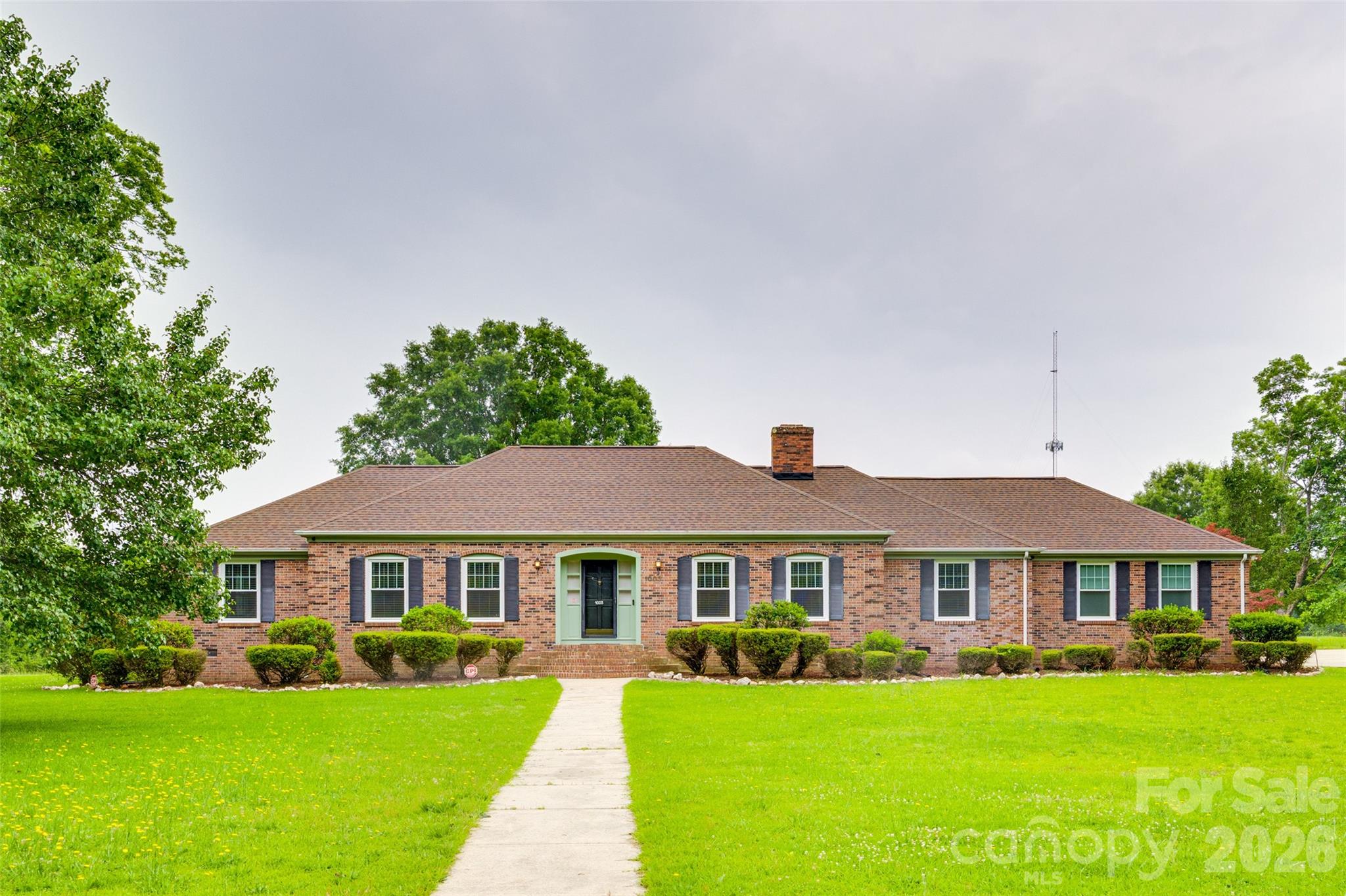 1003 Chesterfield Avenue Lancaster, SC 29720 - Photo 31 of 31 a front view of a house with a garden