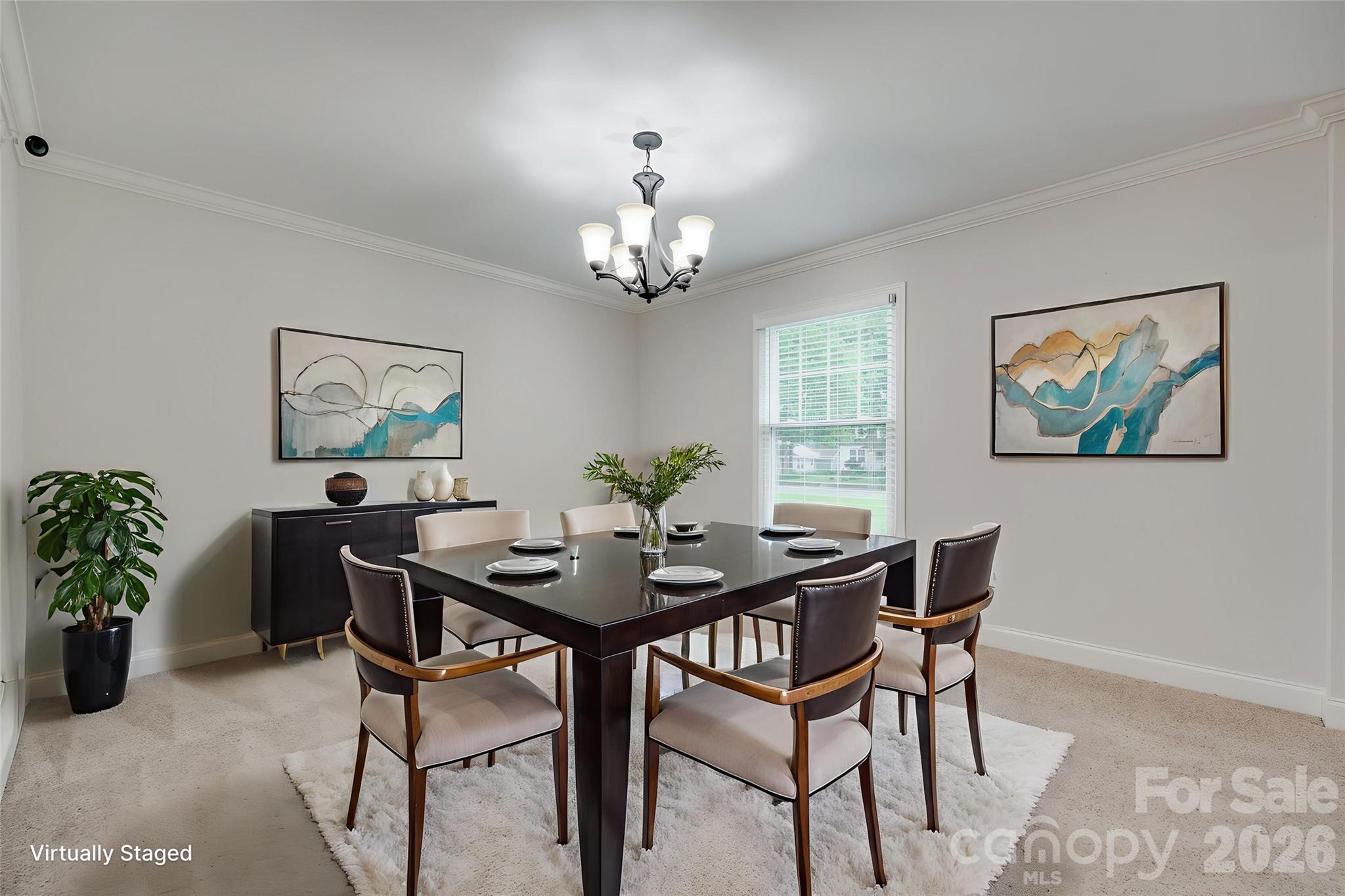 1003 Chesterfield Avenue Lancaster, SC 29720 - Photo 4 of 31 a view of a dining room with furniture a chandelier and wooden floor