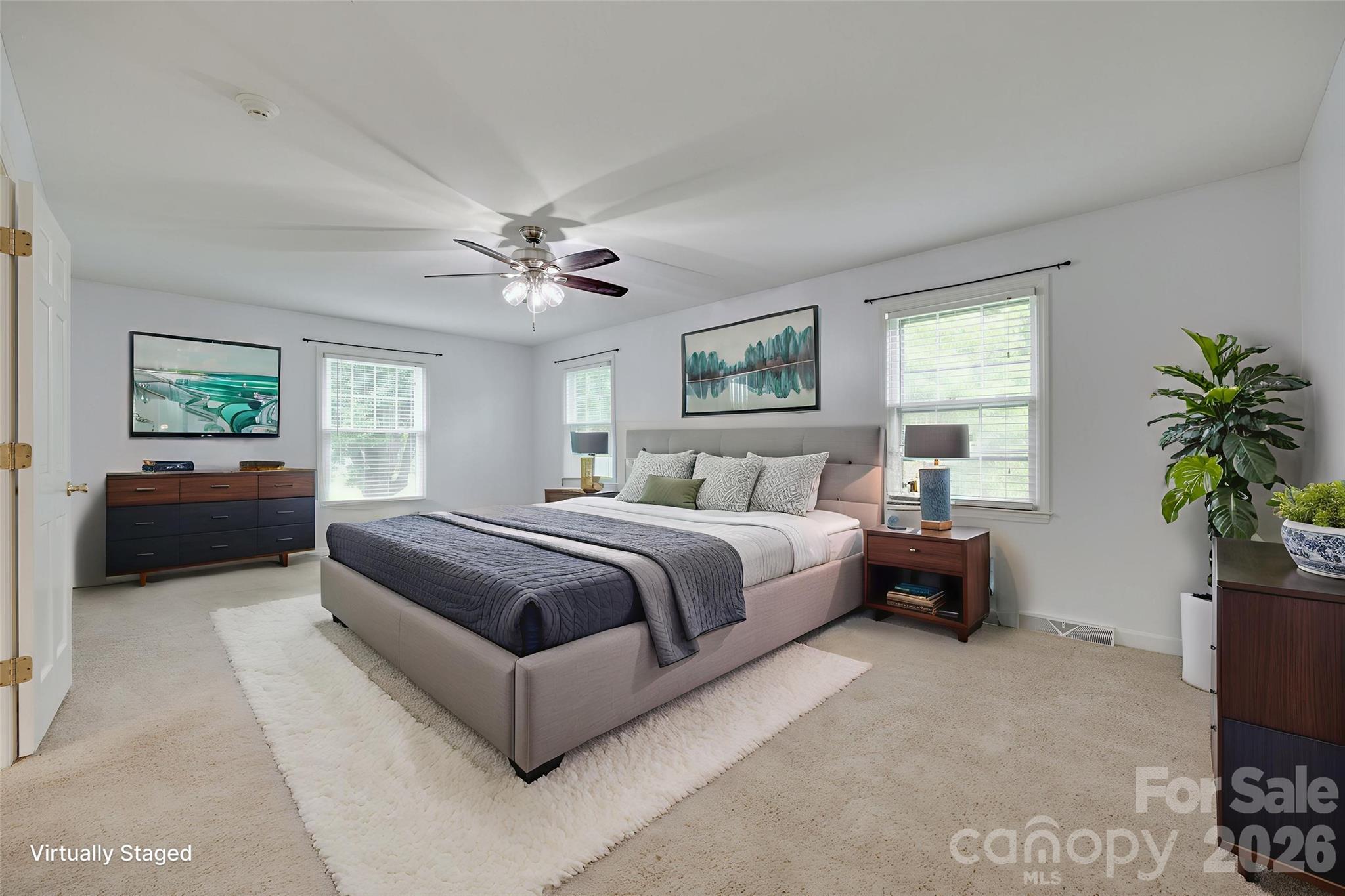 1003 Chesterfield Avenue Lancaster, SC 29720 - Photo 6 of 31 a spacious bedroom with a large bed and a couch