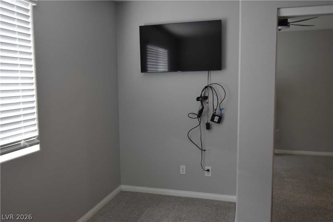 12107 Azure Gate Road, Unit 4 Las Vegas, NV 89183 - Photo 13 of 19 2nd Bedroom next to closet there is an area where you could put a desk