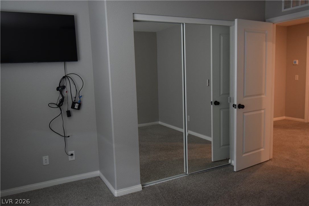 12107 Azure Gate Road, Unit 4 Las Vegas, NV 89183 - Photo 14 of 19 2nd Bedroom closet is with mirror doors
