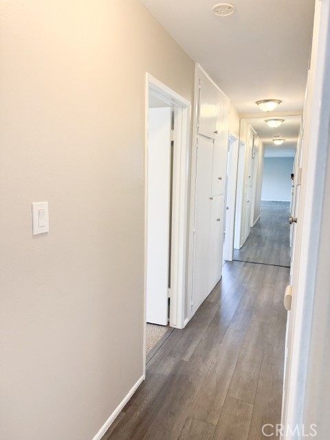 7414 Blackhawk Circle Buena Park, CA 90620 - Photo 6 of 15 a view of a hallway with wooden floor