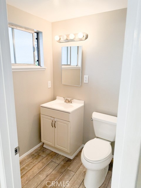 7414 Blackhawk Circle Buena Park, CA 90620 - Photo 9 of 15 a bathroom with a toilet sink and mirror