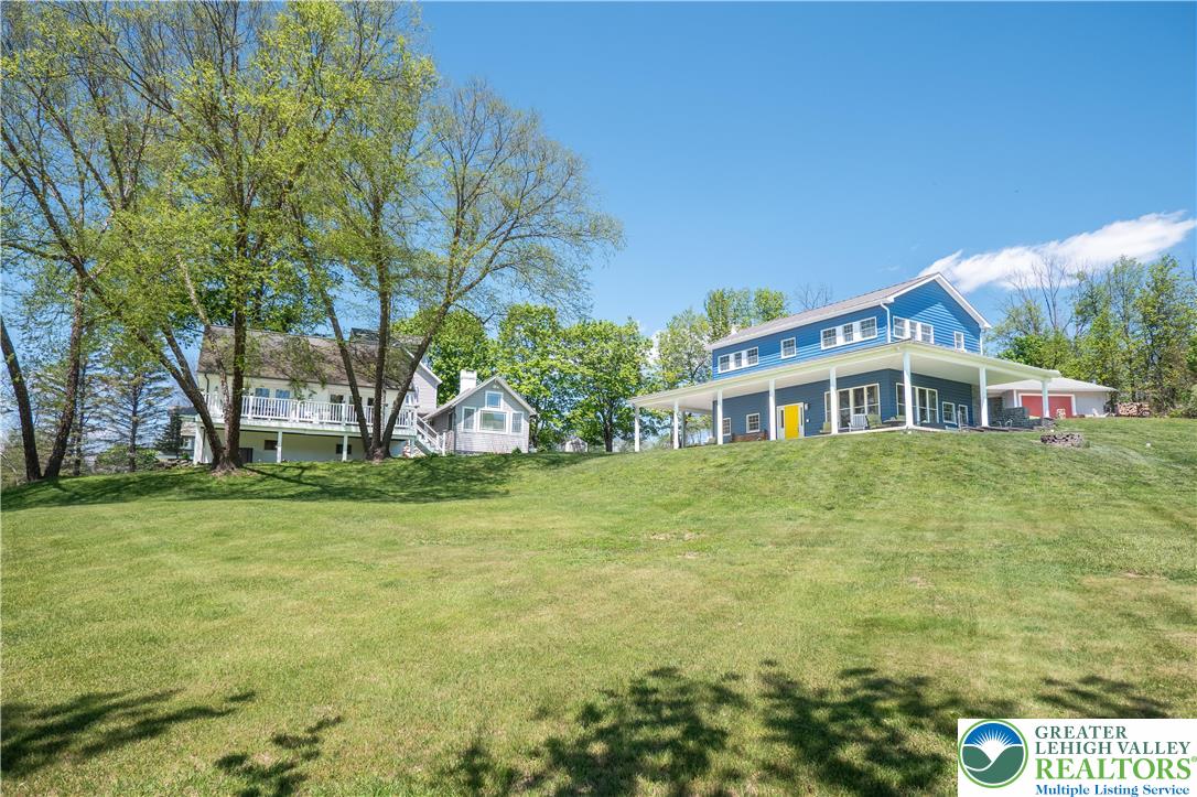 1072 5 Points Richmond Road Bangor, PA 18013 - Photo 1 of 66 a front view of house with outdoor space and trees in the background