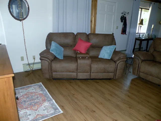 a living room with furniture and a rug