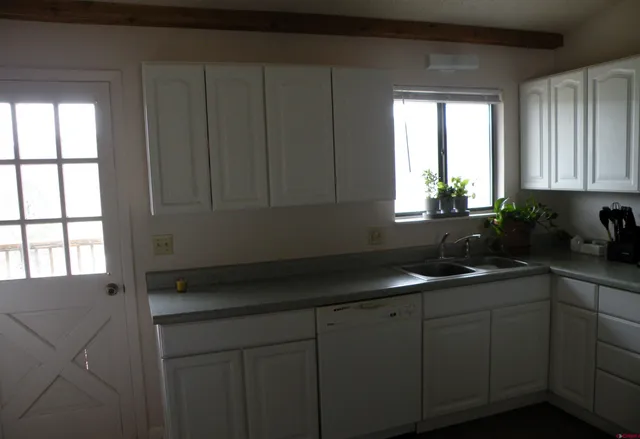 a kitchen with a sink and cabinets