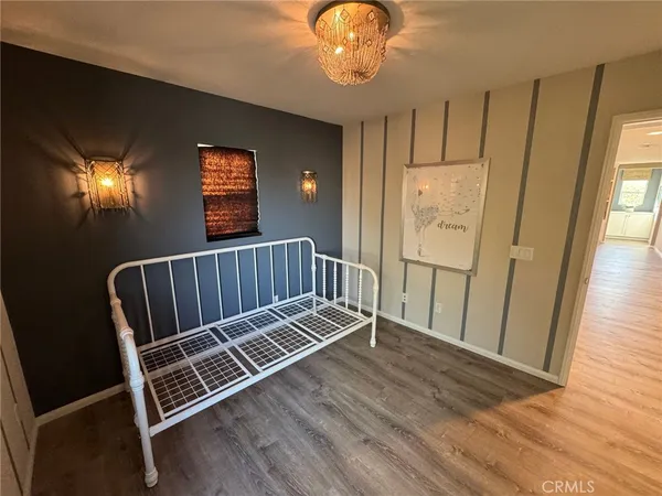 a view of a hall with wooden floor