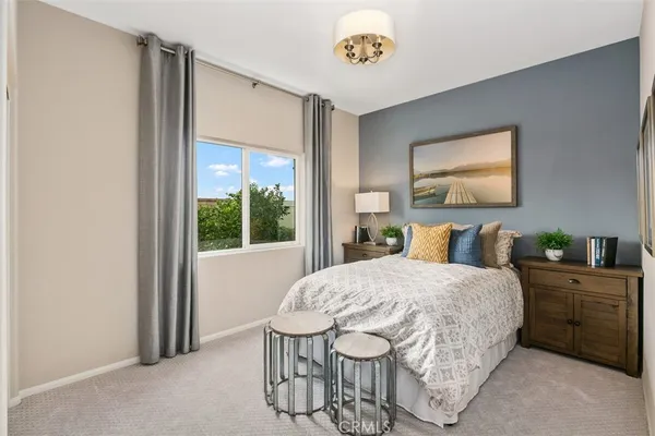 a bedroom with a bed and a table in it