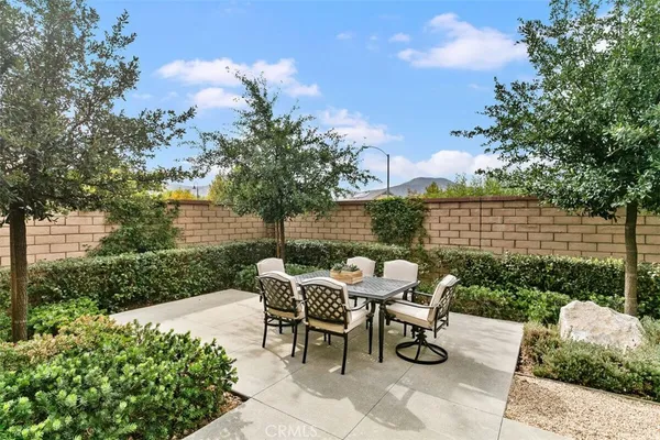 a patio with table and chairs