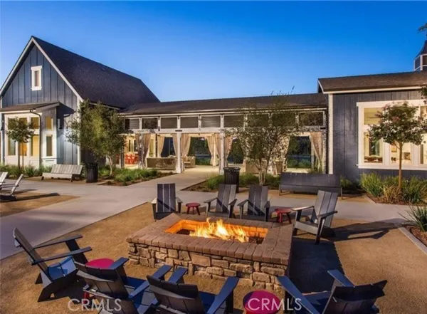 a view of a chairs and table in patio